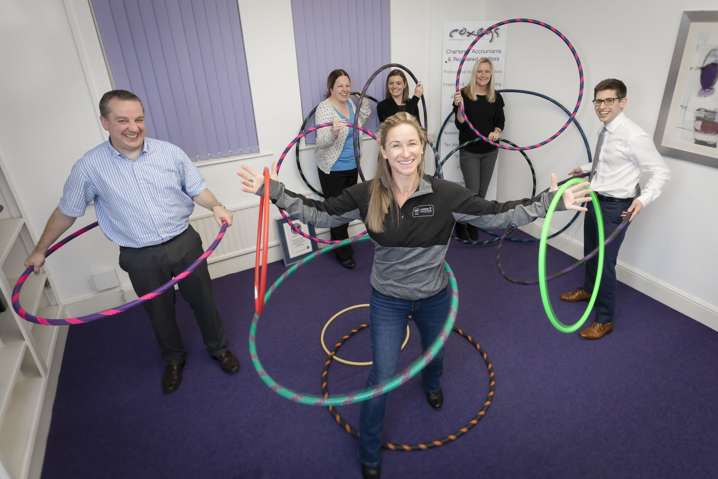 World record-breaking hula hooper building business empire by tacking workplace stress  